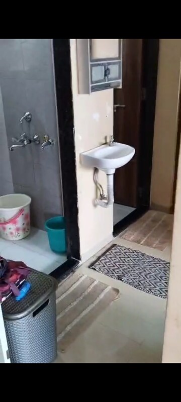Bathroom in 1 BHK Apartment at Rubberwala Fuego, Grant Road – for Sale