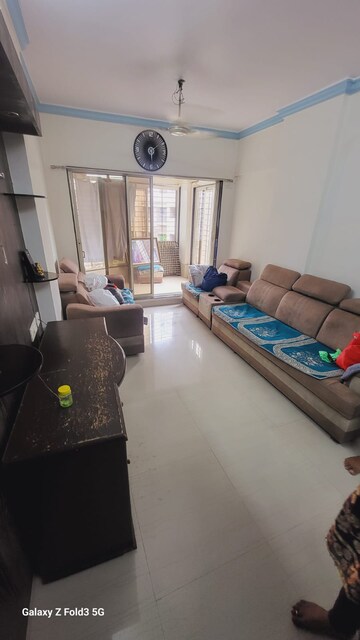Living Room in 1 BHK Apartment at MICL Aaradhya Parkwood, Mira Road – for Sale