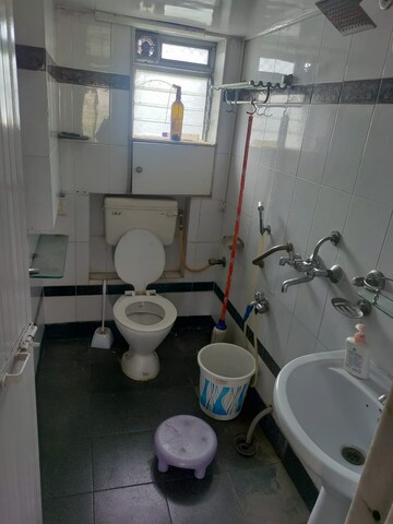 Bathroom in 1 BHK Apartment at Rajiv CHS, Bandra East – for Rent