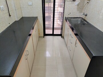 Kitchen in 1 BHK Apartment at Lalani Residency, Kavesar – for Rent