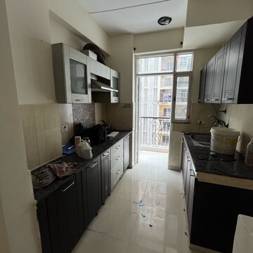 Kitchen in 2.5 BHK Apartment at Prateek Wisteria, Sector 77 – for Rent