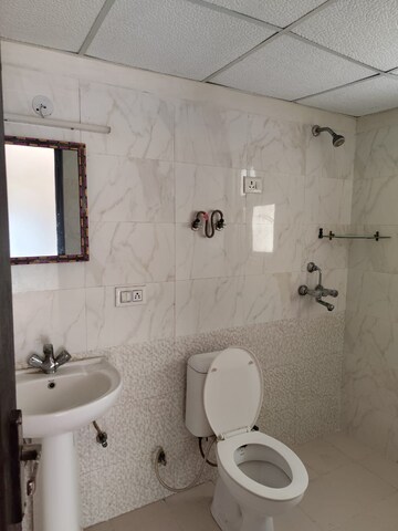 Bathroom in 3 BHK Apartment at Aims Golf City, Sector 75 – for Rent