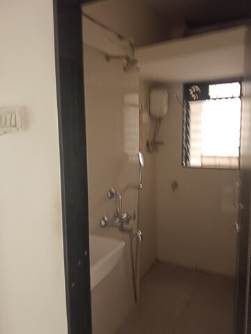 Bathroom in 1 BHK Apartment at Krishnatara CHS, Goregaon West – for Rent