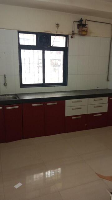 Kitchen in 2 BHK Apartment at Unnathi Woods Phase 1 And 2, Ghodbunder Road – for Rent