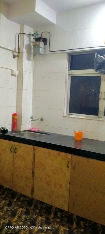 Kitchen in 2 BHK Apartment at Vimala Apartment, Malad West – for Sale