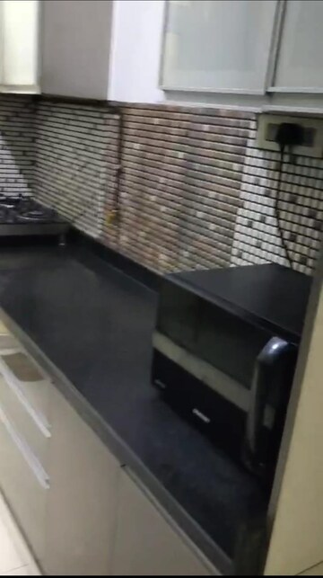 Kitchen in 3 BHK Apartment at Omkar Alta Monte, Malad East – for Rent