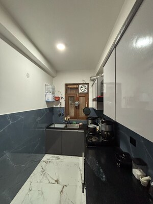 Kitchen in 3 BHK Apartment at Paryavaran Complex – for Sale