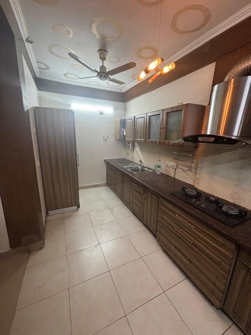 Kitchen in 4 BHK Apartment at Ramprastha Coral Heights, Ramprastha Greens – for Rent