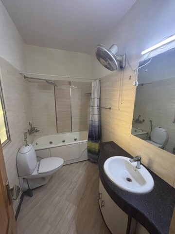 Bathroom in 4 BHK Apartment at Ramprastha Coral Heights, Ramprastha Greens – for Rent
