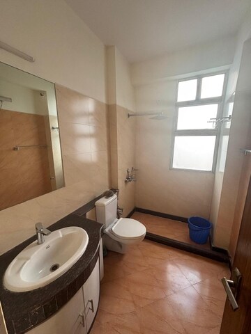 Bathroom in 4 BHK Apartment at Ramprastha Coral Heights, Ramprastha Greens – for Rent