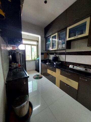 Kitchen in 2 BHK Apartment at Sadguru Heritage, Badlapur West – for Sale
