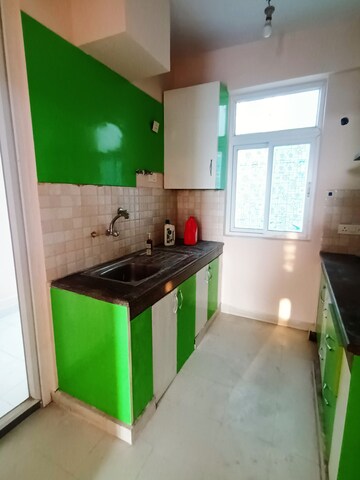 Kitchen in 2 BHK Apartment at Tulsiani Luvnest, Vrindavan Yojna – for Rent