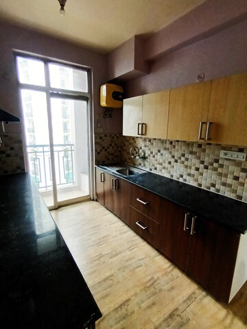 Kitchen in 4 BHK Apartment at Ansals Celebrity Greens, Sushant Golf City – for Rent