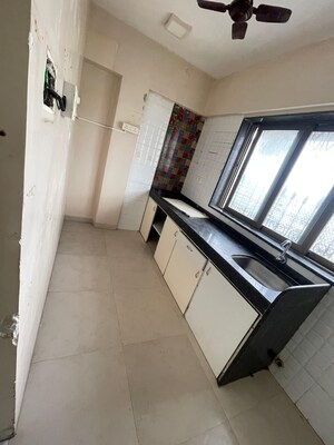 Kitchen in 2 BHK Apartment at Yasmin Tower, Agripada – for Sale