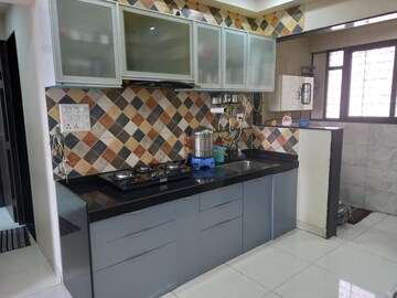 Kitchen in 2 BHK Apartment at Sargam CHS Nanded, Sinhagad Road – for Rent