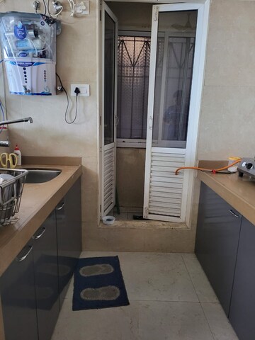 Kitchen in 1.5 BHK Apartment at Dosti West County, Balkum Pada – for Rent