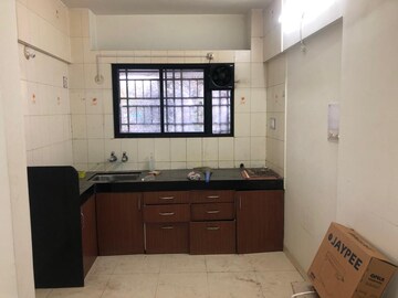 Kitchen in 2 BHK Apartment at Yamunashree Apartment, Dattawadi – for Rent