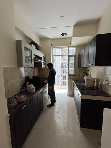 Kitchen in 2 BHK Apartment at Prateek Wisteria, Sector 77 – for Rent