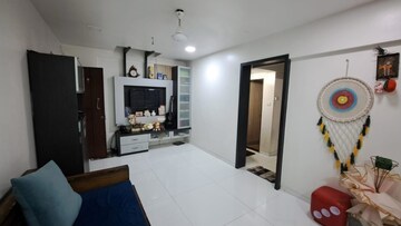 Living Room in 2 BHK Apartment at Hulas Basti Garden CHS, Kandivali West – for Sale