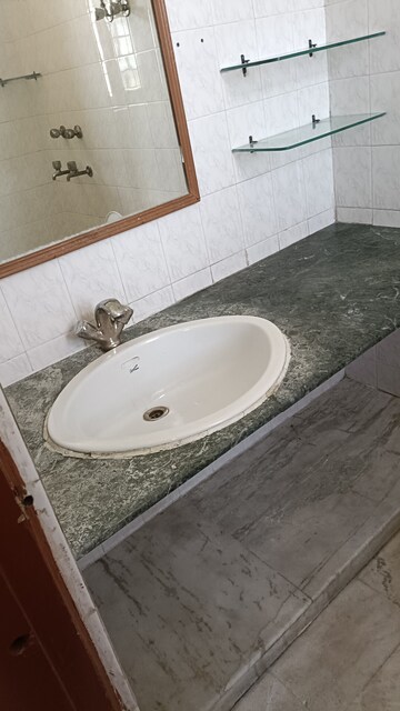 Bathroom in 2.5 BHK Apartment at Arun Vihar, Sector 29 – for Rent