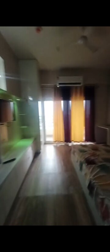 Living Room in Studio Apartment at Paramount Golfforeste, Zeta I Greater Noida – for Rent