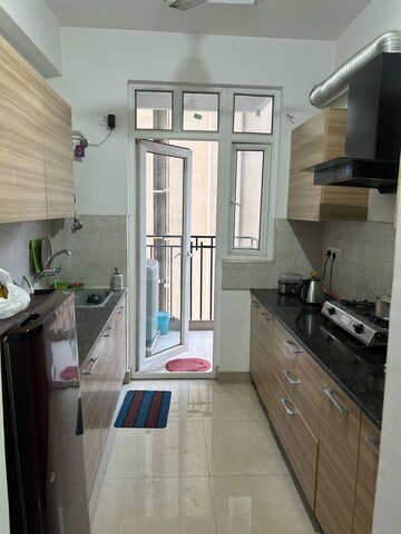 Kitchen in 2 BHK Apartment at ATS Happy Trails, Sector 10 Greater Noida – for Rent