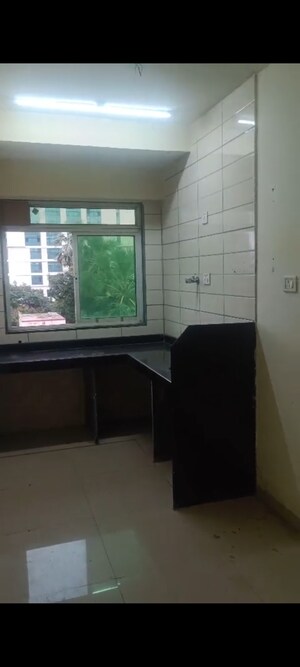 Kitchen in 1 BHK Apartment at Vadgama Kings Tower, Agripada – for Sale