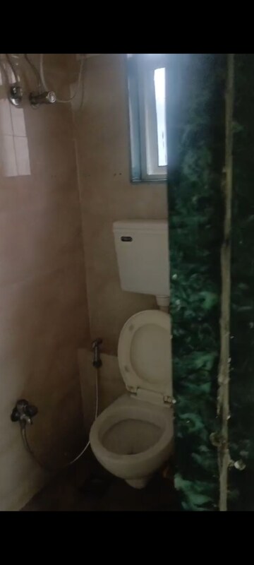 Bathroom in 1 BHK Apartment at Vadgama Kings Tower, Agripada – for Sale
