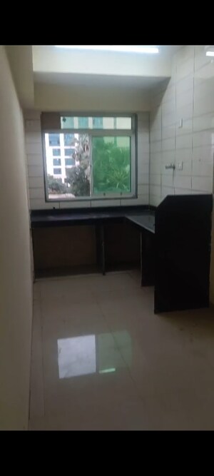Kitchen in 1 BHK Apartment at Vadgama Kings Tower, Agripada – for Sale