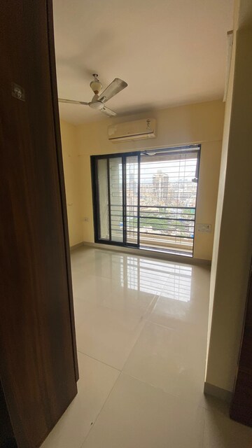 Room in 2 BHK Apartment at DB Orchid Suburbia, Kandivali West – for Rent