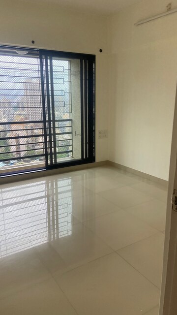 Room in 2 BHK Apartment at DB Orchid Suburbia, Kandivali West – for Rent