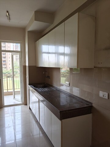 Kitchen in 3.5 BHK Apartment at Emaar Palm Gardens, Sector 83 – for Rent