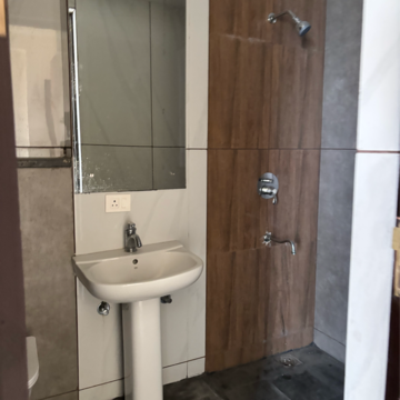 Bathroom in 3.5 BHK Apartment at Mahagun Mezzaria, Sector 78 – for Rent