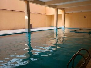 Swimming Pool in 4 BHK Apartment at AFNHB Jal Vayu Towers, Boytawala – for Rent