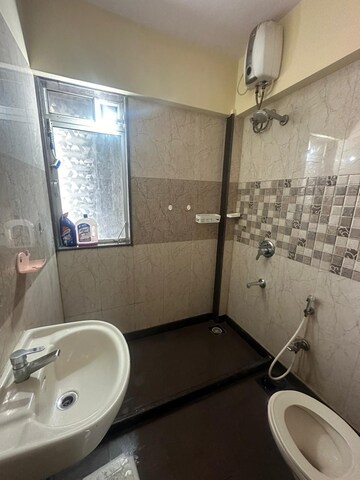 Bathroom in 2 BHK Apartment at Asha Ashok Smruti, Vadavali – for Rent
