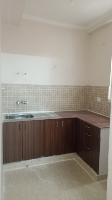 Kitchen in 2 BHK Apartment at Amrapali Golf Homes, Sector 4 Greater Noida – for Rent