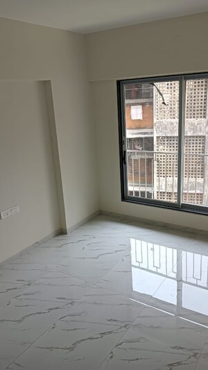 Room in 2 BHK Apartment at Prerana CHS, Borivali West – for Sale