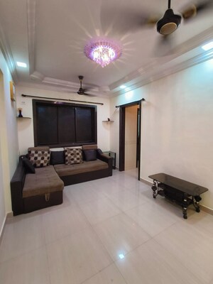 Living Room in 1 BHK Apartment at Swastik Park CHS, Ghodbunder Road – for Sale
