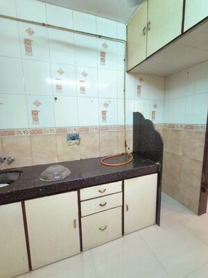 Kitchen in 1 BHK Apartment at Swastik Park CHS, Ghodbunder Road – for Sale