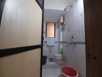 Bathroom in 2 BHK Apartment at Nav Jyotirling CHS, Malad East – for Rent