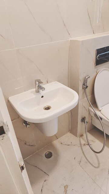 Bathroom in 3 BHK Apartment at Rishita Manhattan, Gomti Nagar – for Rent