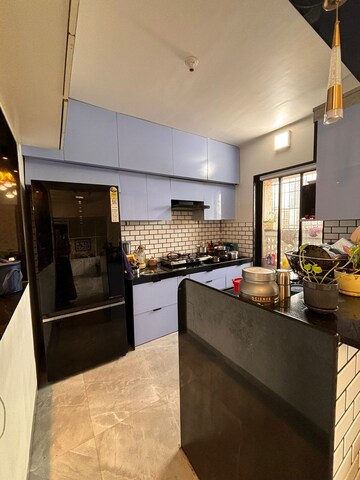 Kitchen in 2 BHK Apartment at Swastik Regalia, Waghbil – for Rent