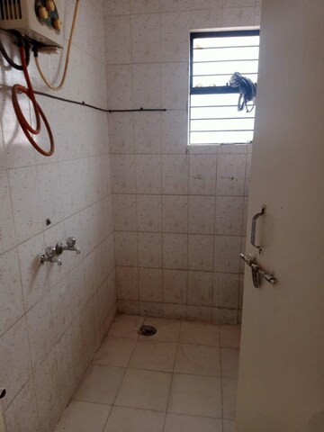 Bathroom in 1 BHK Apartment at Kudale Patil Township, Vadgaon Budruk – for Rent