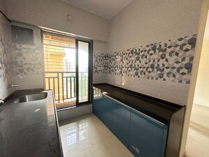 Kitchen in 2 BHK Apartment at Cosmos Park, Ghodbunder Road – for Sale