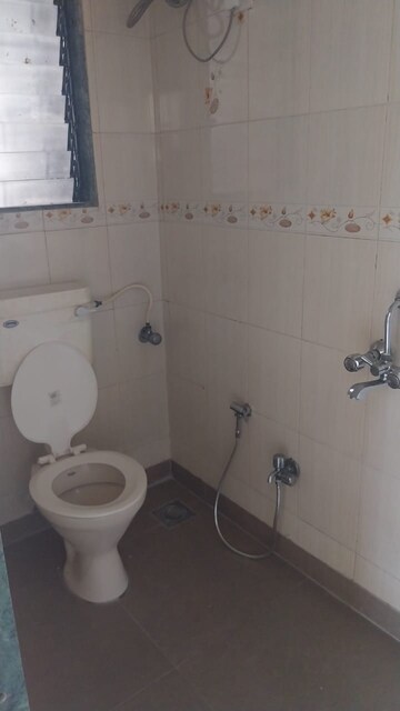 Bathroom in 3 BHK Apartment at Tilak Nagar – for Rent