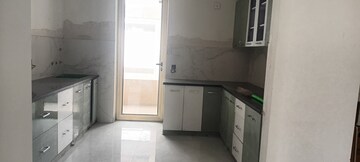 Kitchen in 4 BHK Apartment at Ramprastha Greens – for Sale