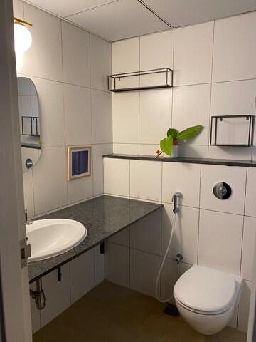 Bathroom in 2 BHK Apartment at Godrej Aqua, International Airport Road – for Rent