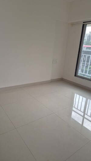 Bedroom in 1 BHK Apartment at Satellite Garden, Goregaon East – for Sale