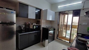 Kitchen in 3 BHK Apartment at Dosti Group Imperia, Manpada – for Rent