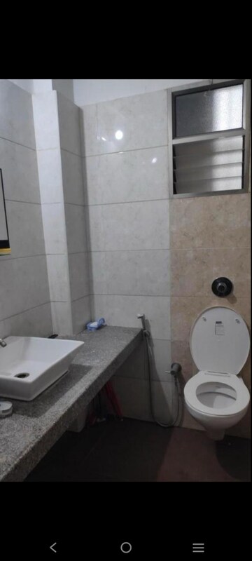 Bathroom in 3 BHK Apartment at HN Safal Orchid Harmony, Shela – for Rent